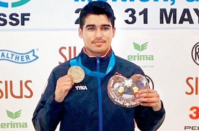 India shooter Saurabh Chaudhary celebrates on the podium after winning gold in 10m air pistol event at the ISSF World Cup yesterday