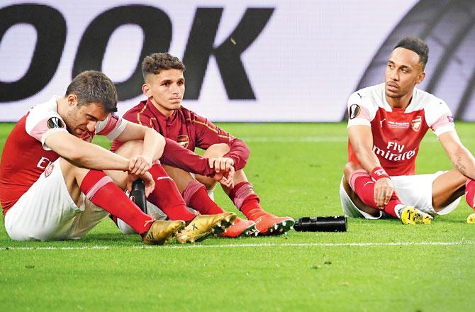 Arsenal players are dejected after the final on Wednesday. Pic/AFP