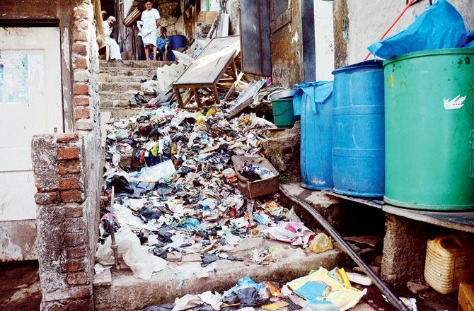 Mounds of garbage accumulated around Pathan chawl