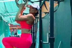 Deanne Panday sizzles in hot pink gym wear. See Photos
