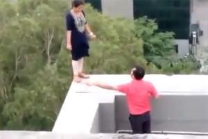 Woman does a 'Dharmendra' from 'Sholay'; threatens to jump off roof