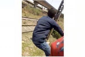 Video: Minor boys perform death-defying stunt on Mumbai local train
