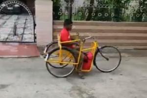 Differently abled man delivers food in a hand pulled tricycle