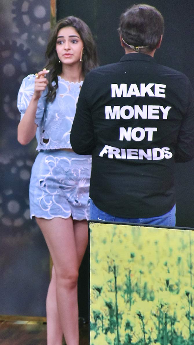 In this picture, Ananya might be busy with something else but it's Chunky's shirt that has all our attention. Why? The quote says it all- Make Money Not Friends. Do you agree?