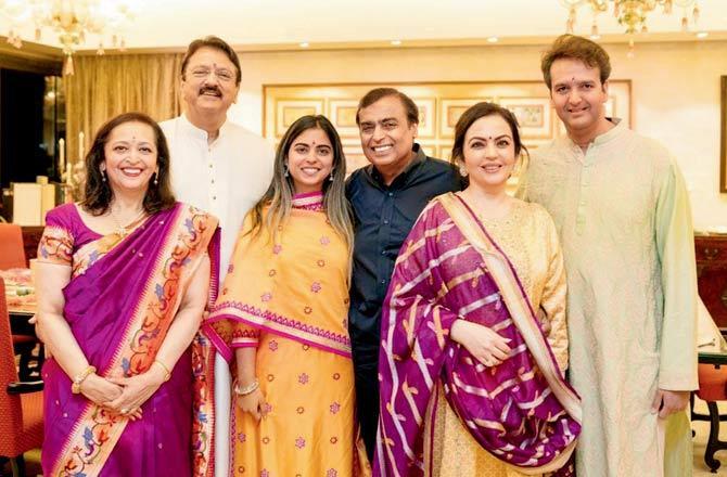 In picture: Nita Ambani and family paint a happy family portrait as they pose for a picture with the Piramals.