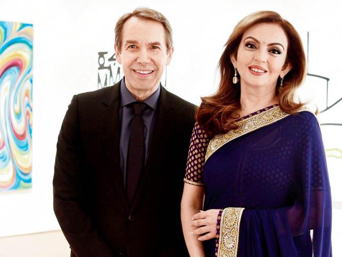 In March 2016, Christies hosted a dinner reception in honour of Nita Ambani in New York. For the dinner, Nita Ambani looked simple and elegant in a midnight blue sari with minimal jewellery and accessories. Nita looked graceful as she posed for a picture with American artist Jeff Koons.