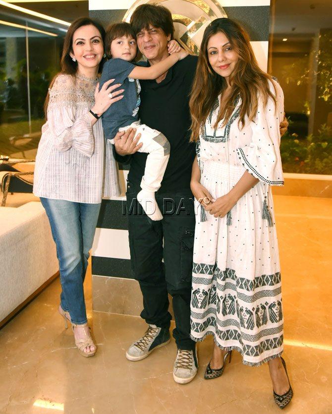 In October 2017, Nita Ambani was spotted alongside Shah Rukh Khan and his son AbRam as they visited Gauri Khan's store in Juhu. For her outing in the suburbs, Nita Ambani donned a peach frill top and paired it with denim. She was seen having a cheerful time with SRK and his wife Gauri. Picture/Yogen Shah
