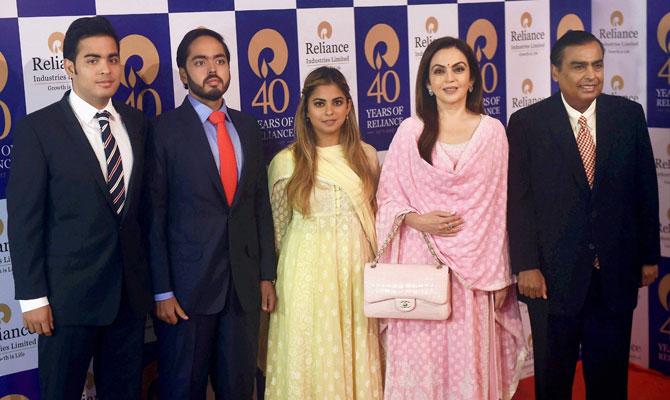 In picture: Nita Ambani poses for a family picture along with husband Mukesh, daughter Isha and sons, Akash and Anant Ambani, at the launch of the Jio event in Mumbai.