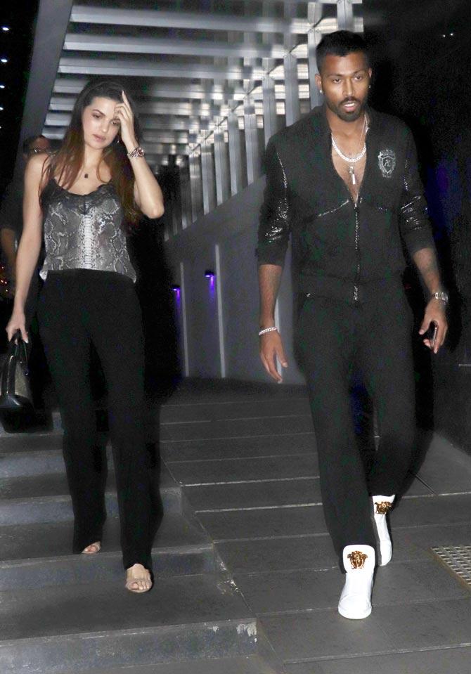 Hardik Pandya looked dapper in an all-black jacket and trousers with white sneakers while Natasa Stankovic wore black pants and a silver sleeveless top