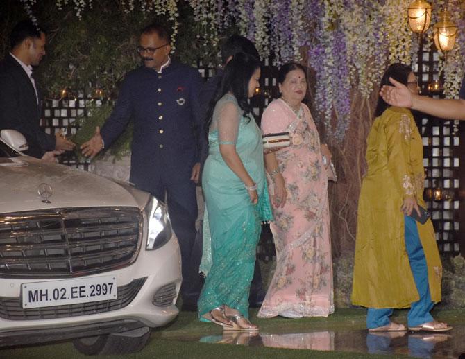 Mukesh Ambani's mother KokilaBen Ambani graced the party with her presence in a light pink floral-printed saree.