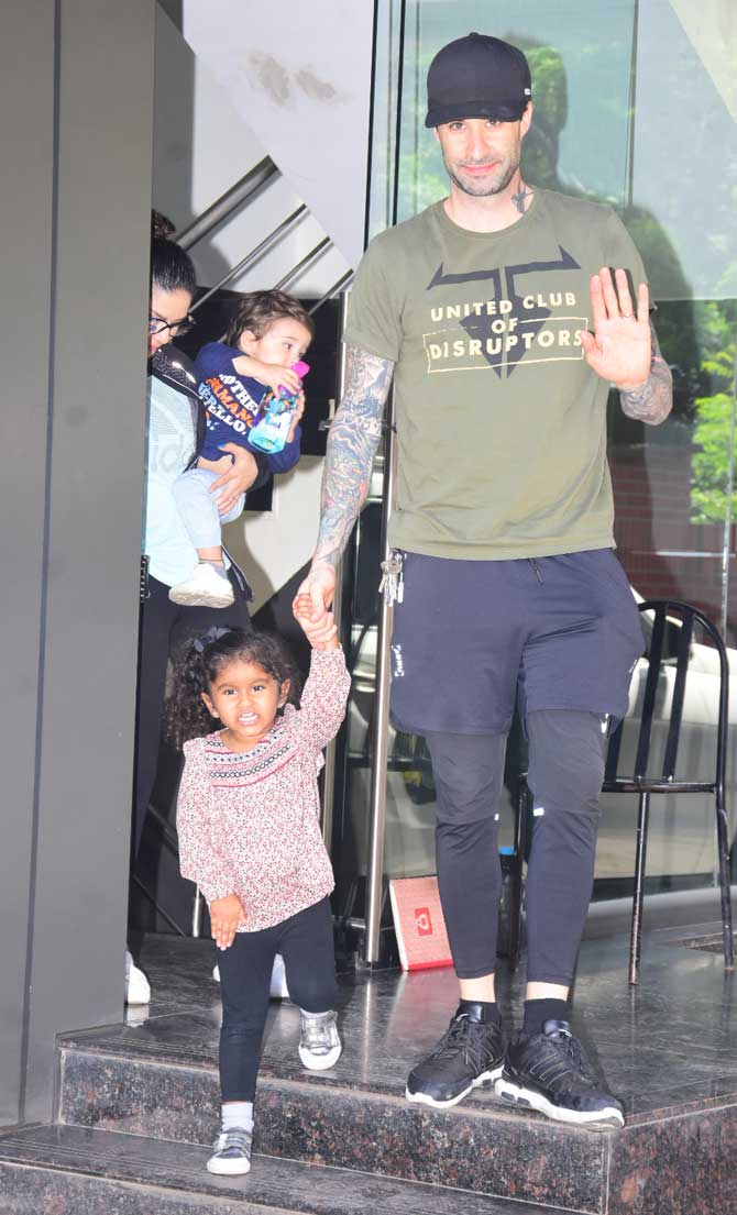 Sunny Leone, husband Daniel Weber and her adorable kids - Nisha Kaur Weber, Noah Singh Weber and Asher Singh Weber were clicked by the photographers in Juhu, Mumbai. All pictures/Yogen Shah