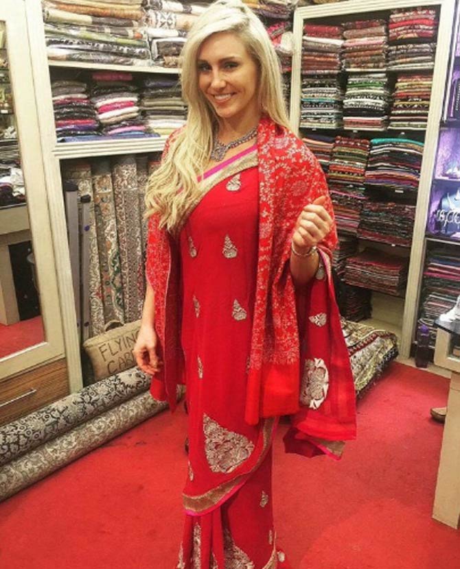 Charlotte Flair first shared a photo of her looking beautiful and radiant in a red saree. She captioned the photo saying, 'Can’t wait to get another saree! What color should I get?!?! @WWEIndia Headed to Mumbai & Bengaluru'