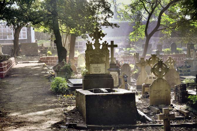 Scenic frame as the morning sun settles on the tombstones and graves.
