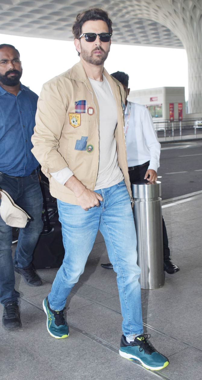 Greek God Hrithik Roshan was snapped at Mumbai airport as well. The actor looked dapper in a tan jacket, white t-shirt and basic denims. 