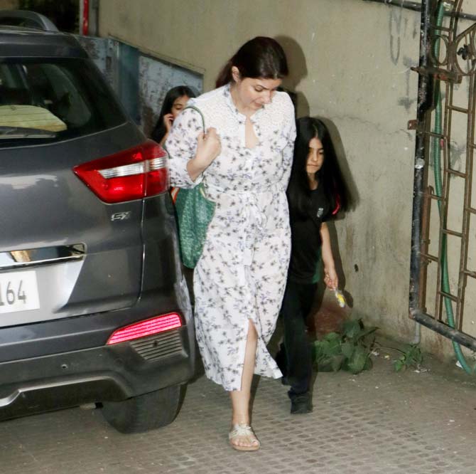 Twinkle Khanna accompanied her daughter Nitara for a refreshing salon session in Juhu, Mumbai. The actress-turned-author opted for a white dotted dress for the outing, while Nitara looked cute as a button in her black attire. All pictures/Yogen Shah 