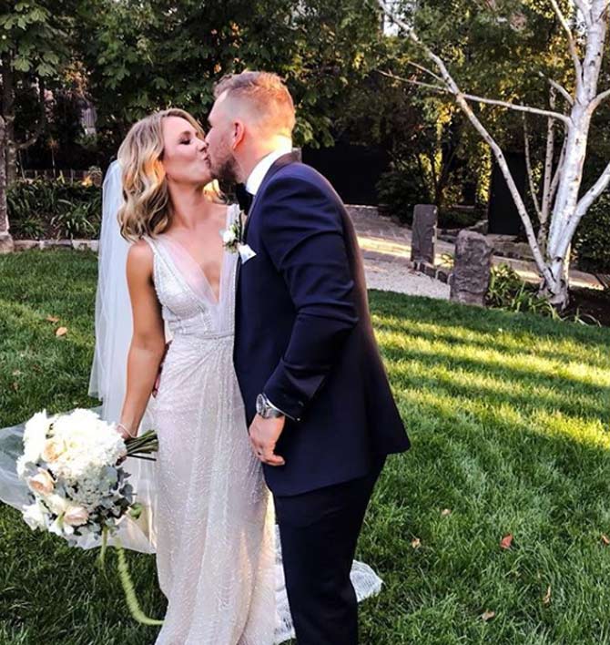 Aaron Finch shared a candid photo along with bride Amy from their wedding day and simply captioned it - What an amazing day! #grinchwedding