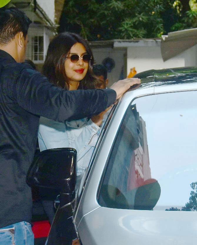 Priyanka Chopra Jonas was spotted at mother Madhu Chopra's clinic in Juhu, Mumbai. The actress was seen wearing a black dress, which she paired with a denim jacket during the outing. All pictures/Yogen Shah