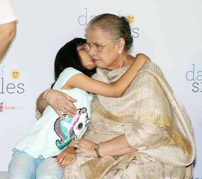 Aishwarya Rai Bachchan also shared pictures from the NGO event in her Instagram post. The pictures had Aish with mother Vrinda and daughter Aaradhya spending some quality time with kids at the event.
In picture: Aaradhya Bachchan seen kissing grandma Vrinda Rai at the event. Aint she adorable!