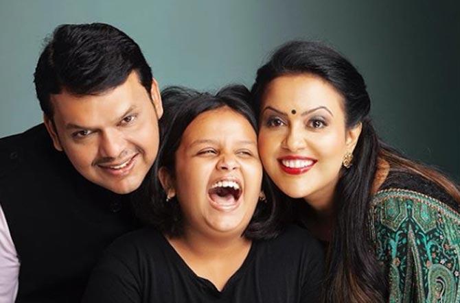 In an interview, Devendra Fadnavis admitted that they never went to see a movie after shifting to Mumbai. 
In photo: Divija shares a candid moment with her father and mother during a photoshoot. 