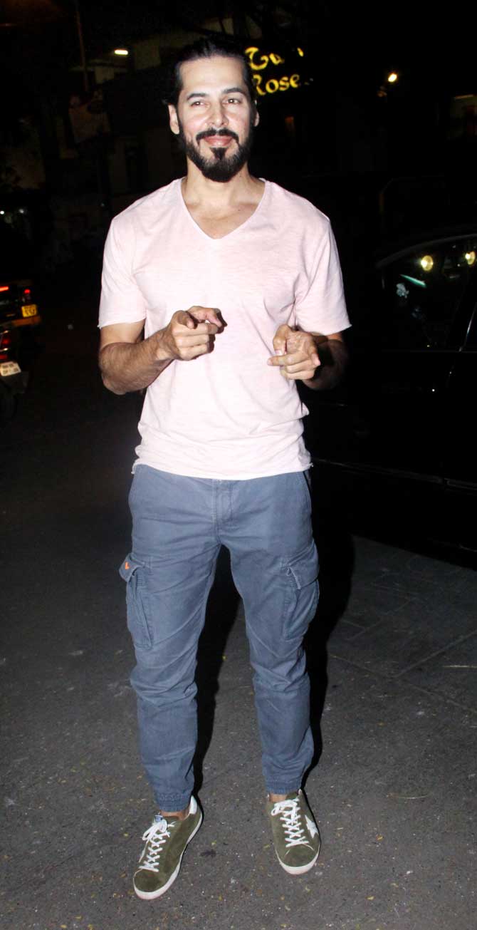 Dino Morea was happy to pose for the shutterbugs at the restaurant launch event in Bandra, Mumbai.