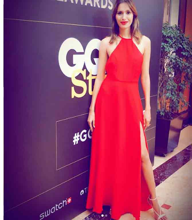 She looked fierce as a presenter at the GQ Style Awards last year in this red halter neck gown, paired with white stilettos and her hair loose.