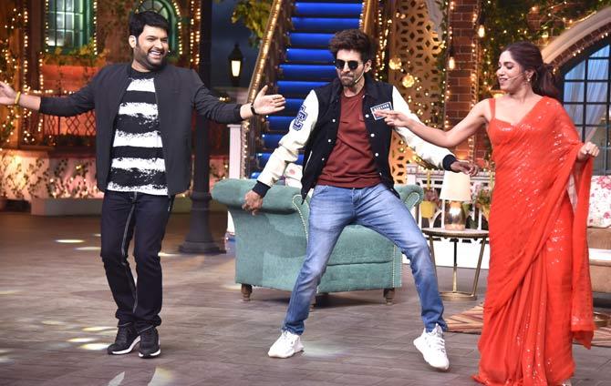 The cast of Pati, Patni Aur Woh, Kartik Aaryan, Bhumi Pednekar and Ananya Panday were snapped promoting the film on the sets of The Kapil Sharma Show. All pictures/Yogen Shah
In picture: Kapil Sharma was clicked dancing with Kartik Aaryan and Bhumi Pednekar at the promotional event.