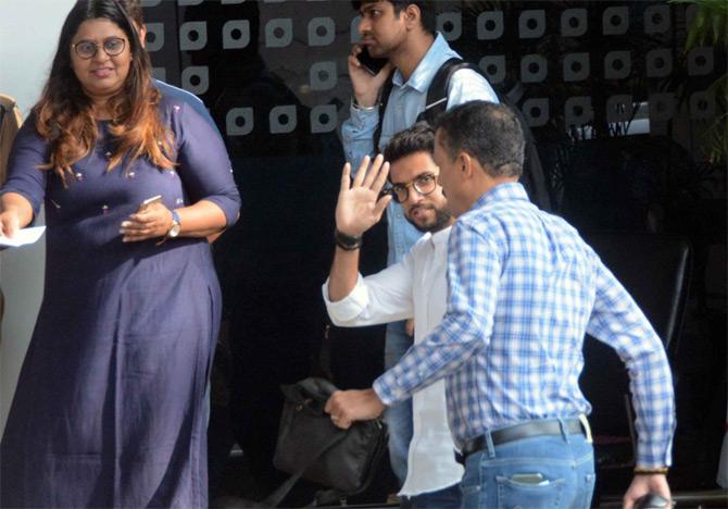 Aaditya Thackeray donned a plain white shirt and blue trousers for his outing and was seen waving at the photographers