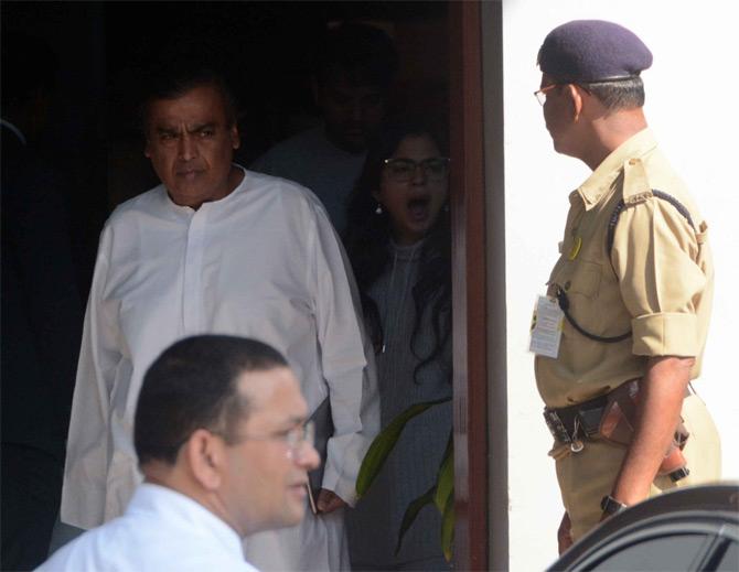 In picture: Isha Ambani caught in a candid moment as she and Mukesh Ambani make their way towards their cars at the Kalina airport in Santacruz