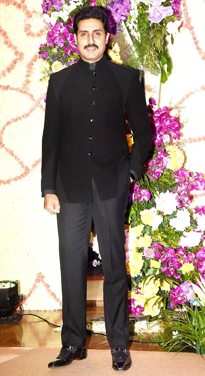 Abhishek Bachchan opted for an all-black suit to attend Sooraj Barjatya's son Devaansh Barjatya's wedding reception held at a plush hotel in Mumbai.