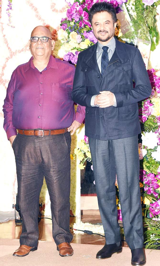 Satish Kaushik and Anil Kapoor were clicked together as they posed for the shutterbugs at the wedding reception of Devaansh Barjatya at a 5-star in Juhu, Mumbai.