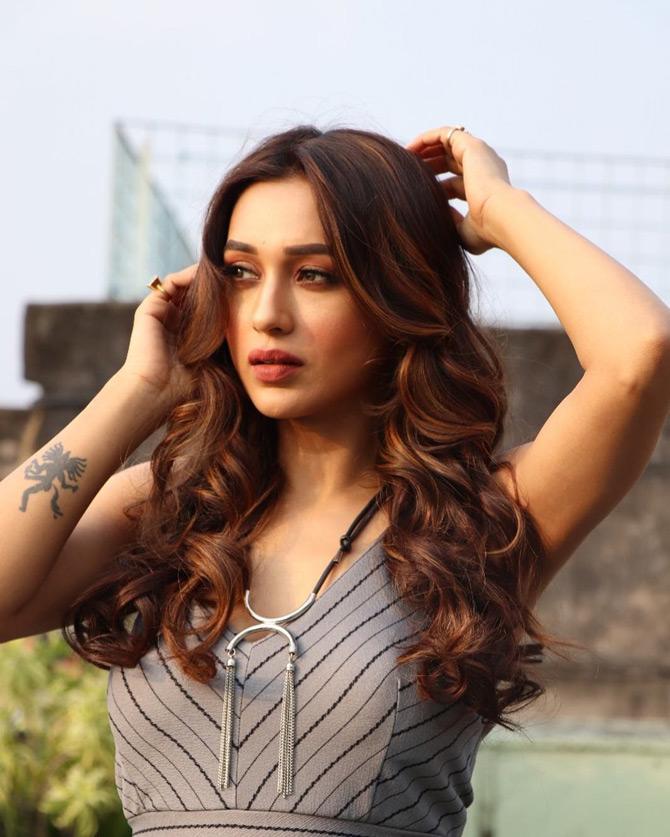 Mimi shared this photo from her acting and modelling days. In the photo, actress-turned-politician Mimi Chakraborty shines in a grey stripped outfit as she is seen caught in a candid moment while she plays with her hair. Mimi captioned it: no quotes no lines nothing I can find now...!