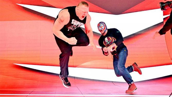 Little did Lesnar know that Rey Mysterio was tracking him and attacked him from behind with a pipe leaving Lesnar on the floor