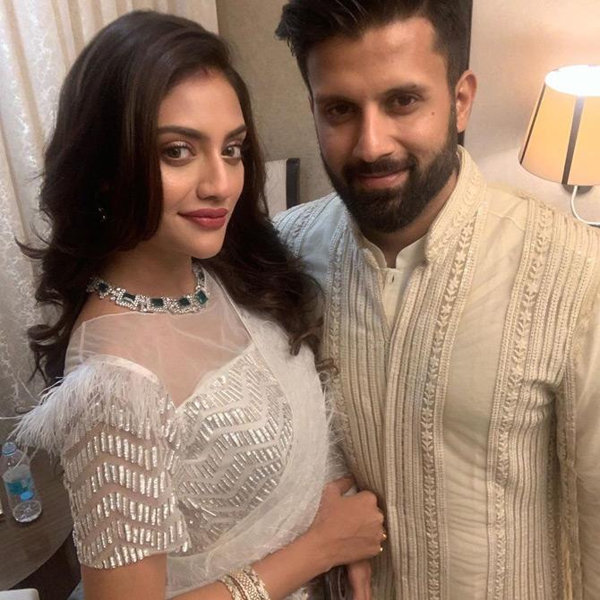In photo: Nusrat Jahan and Nikhil Jain strike cupid as the two lovebirds twin in hues of white.