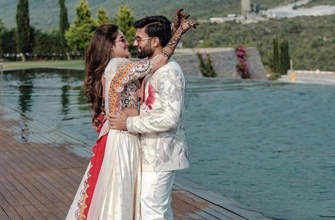 For their wedding, Nusrat Jahan looked every bit the traditional bride in a red designer lehenga while her husband Nikhil Jain, looked suave as he opted for an ivory ensemble by the same designer for the D-day.