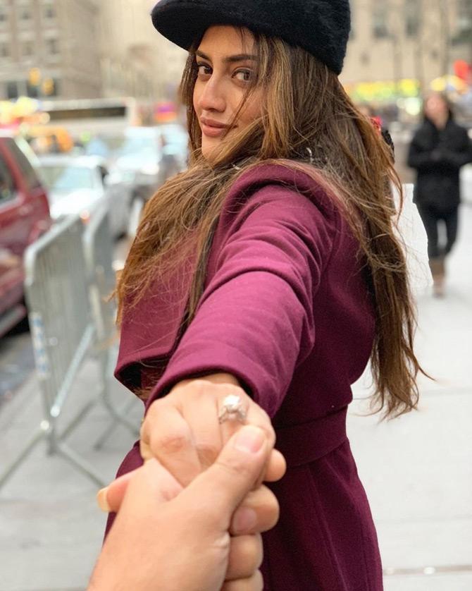 In photo: While sharing this picture, Nusrat Jahan makes an attempt to replicate the Follow Me Couple pose as she flaunts her ring while holding Nikhil Jain's hand.
