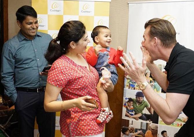 While Brett Lee was in Bengaluru, he captioned this photo: Playing peekaboo with a gorgeous cochlear recipient! An amazing life ahead of her! The smile says it all @cochlearindia #soundsofcricket #hearingmatters