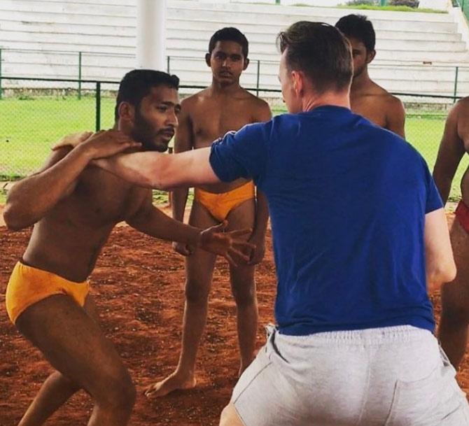 In picture: Brett Lee engaging in India's traditional sport of wrestling called 'Dangal'.