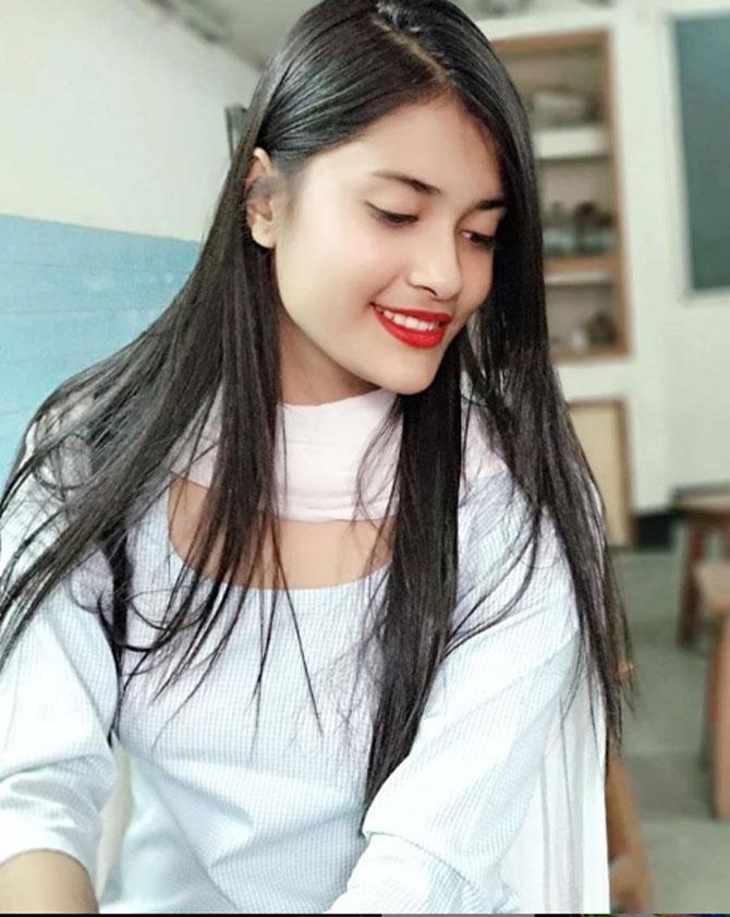 The 19-year-old wore an off-white salwar suit with a dupatta and donned red lipstick with it, as she was captured in a candid moment.