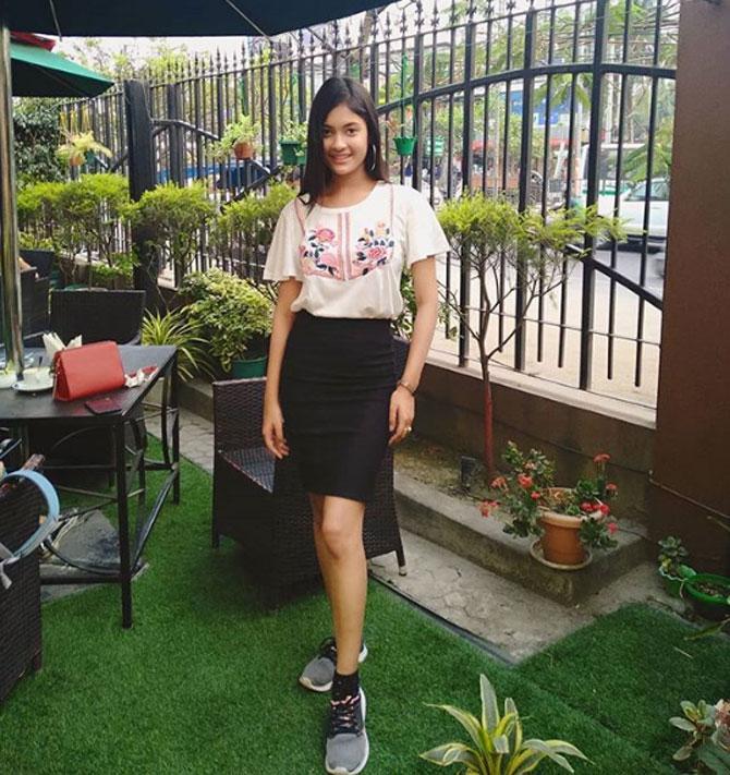 Jyotishmita styled a white top with embroidery and paired it with a plain-black knee-length skirt, which is shorter in front and longer at the back. She paired it up with shoes and wrote, 