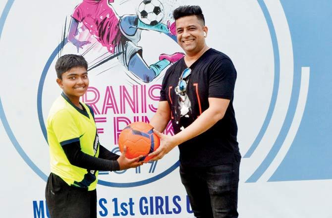 Canosa HS striker Bhumika Mane, who scored nine goals in three matches, receives the match ball from UK Utd FC