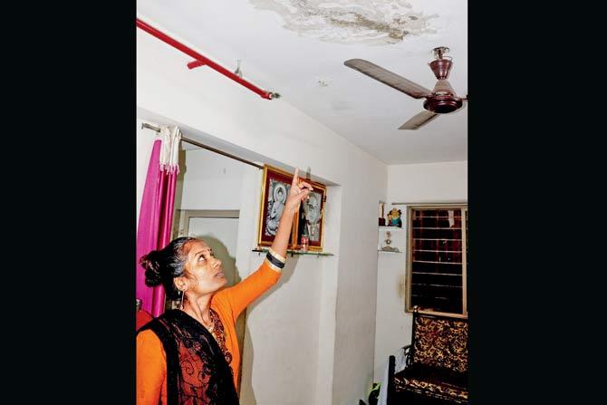 Surekha Jagtap points to the damaged ceiling caused due to leakage in her flat. Pics/Rajesh Gupta