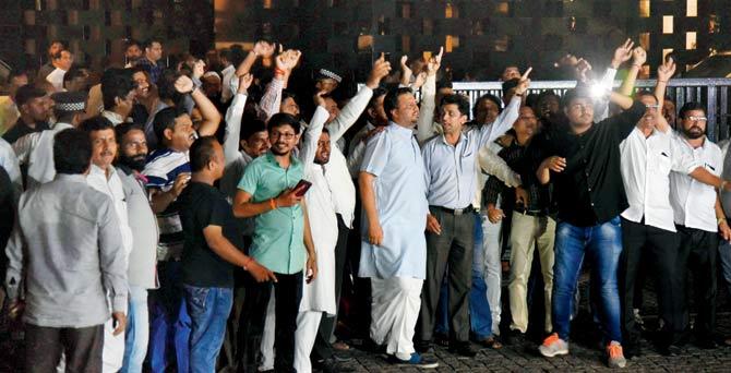 Workers from all parties cheer at Trident, BKC