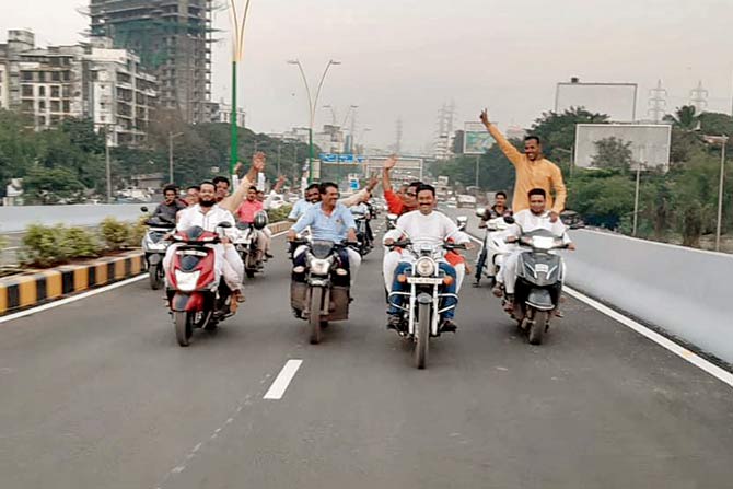 Corporator Kaptan Malik seen with a party worker near the BKC–Chunabhatti flyover, demanded that two-wheelers be allowed