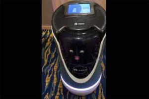 Woman orders coffee pods, room service robot delivers it
