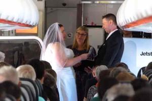 'Please kiss your bride': Aviation-loving couple get married mid-flight