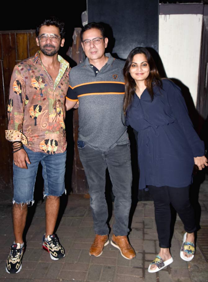 Salman Khan's sister Alvira Agnihotri along with husband Aayush Sharma and Sunil Grover pose for the photographers at Dabangg 3 wrap up party.