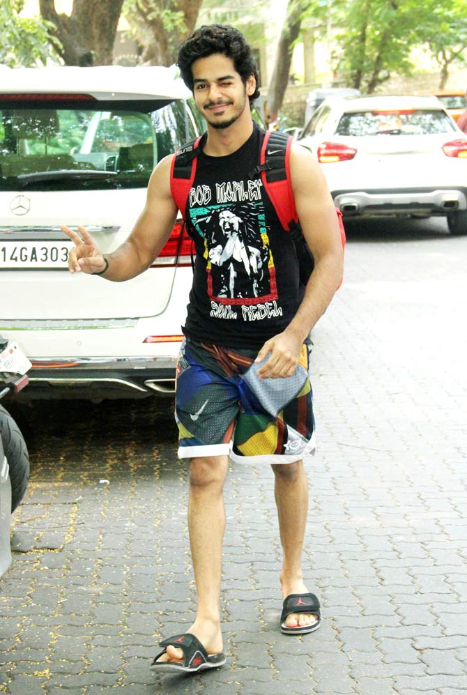 Ishaan Khatter opted for colourful gym shorts paired with a graphic tank top for his outing. 