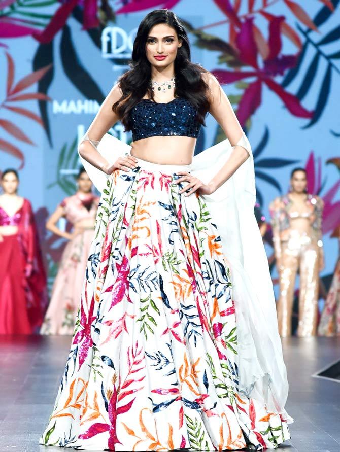 Athiya Shetty walked the ramp for designer Mahima Mahajan on the day 3 of Lotus India Fashion Week in New Delhi. Athiya wore tropical print lehenga with sequinned blue choli.