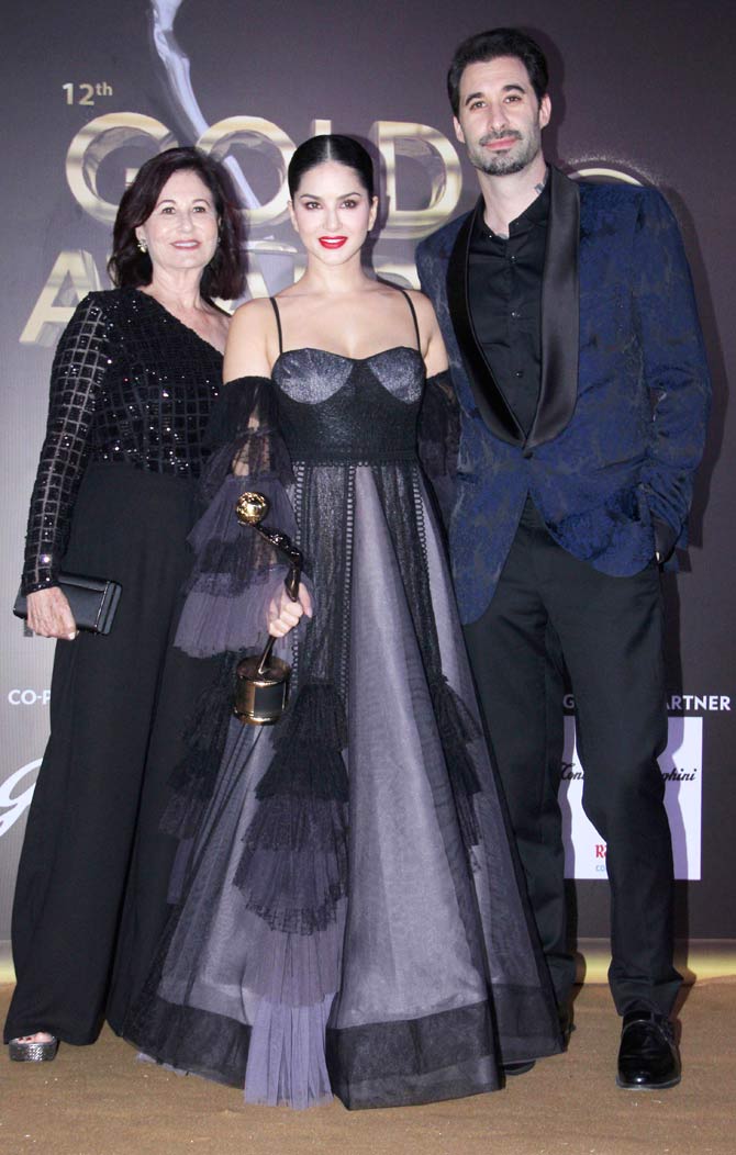 Sunny Leone looked fabulous in a grey-black gown with dramatic sleeves. The actress won the Icon of the Year award at the event. Daniel Weber, too, looked dapper in his suit.