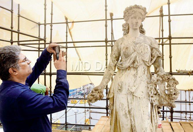 Conservation Architect Vikas Dilawari during the restoration process at the topmost level of the fountain. Dilawari and his team comprising Altaf Muwal, Prajakta Deshpande, Lester Silviera and consultant Kiran Bhavsar have been closely with the other experts to set a high benchmark in restoration